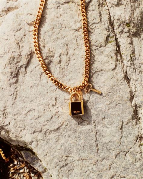 Shop Celine’s Gold Lock and Key Charm Necklace 